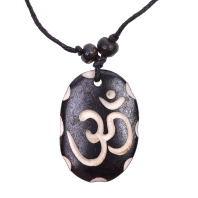Амулет из кости ОМ в овале