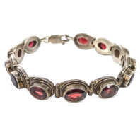Тибетский браслет из 12 камней граната длиной 17см Тибетский браслет из 12 камней граната длиной 17см