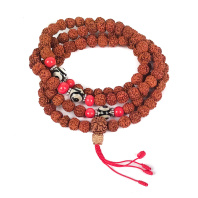 Четки из семян дерева Рудракши 108 бусин диаметр 6-7мм с разделителем из бусины ДЗИ Четки из семян дерева Рудракши 108 бусин диаметр 6-7мм с разделителем из бусины ДЗИ